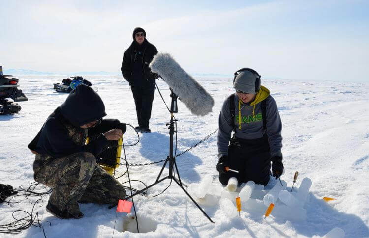 listening to sounds under the ice